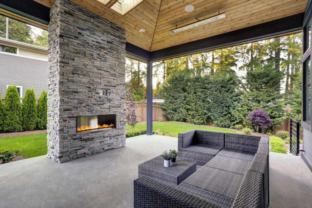 mdoern deck with stone fireplace