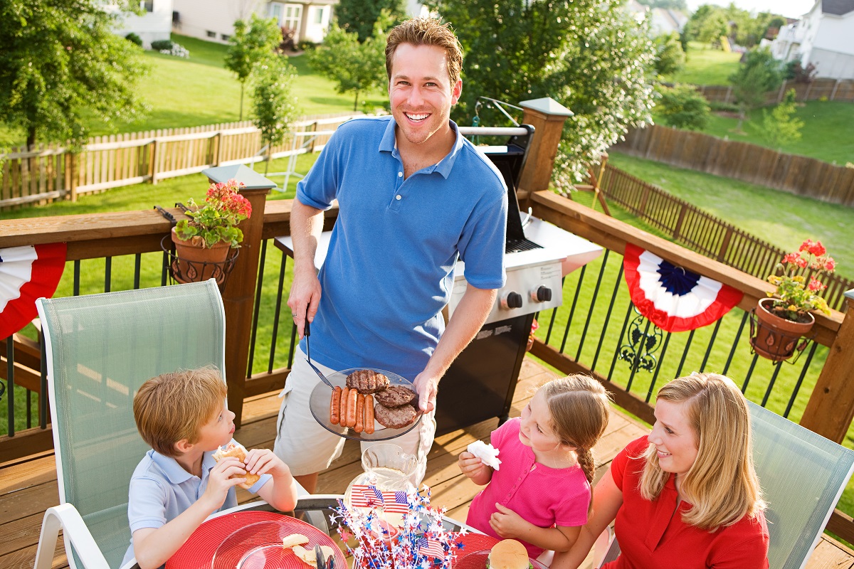 family BBQing on a summer day