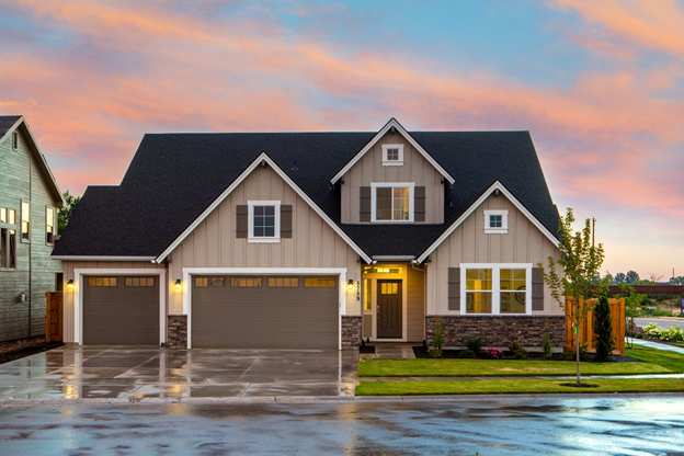 big luxury house with front yard and garage