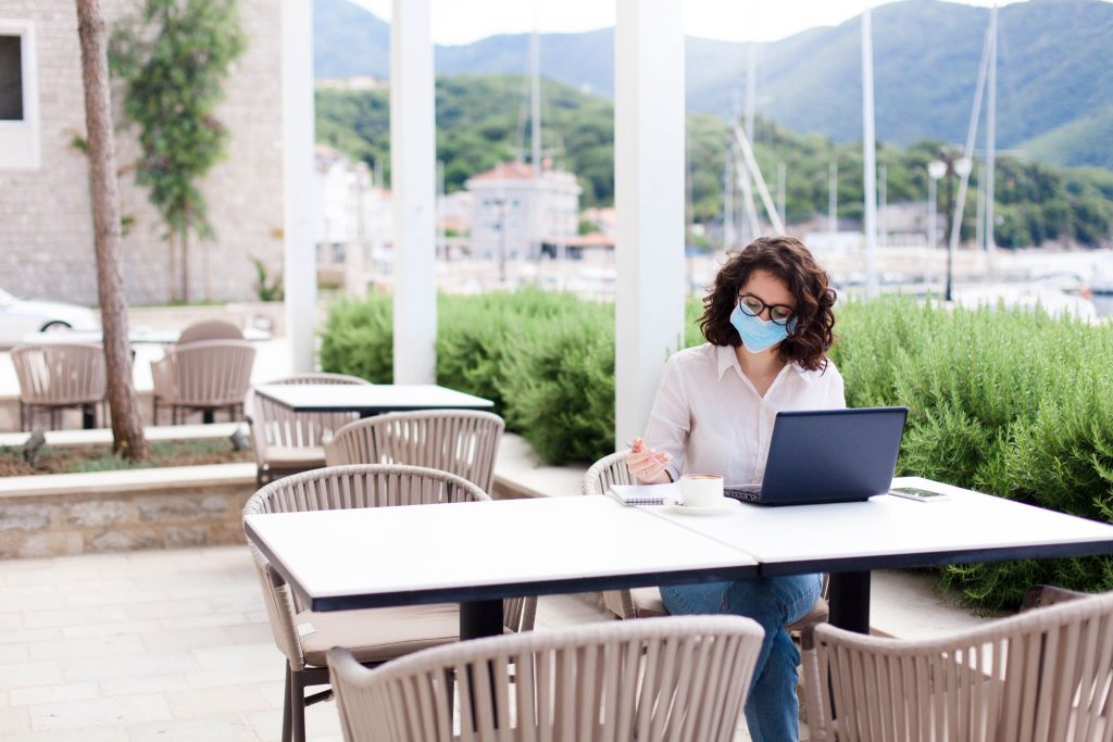 women working at cafe with face mask