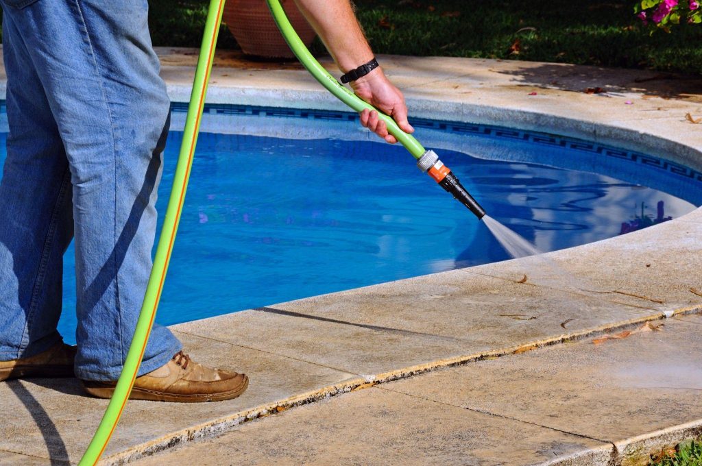 Hosing poolside pathway