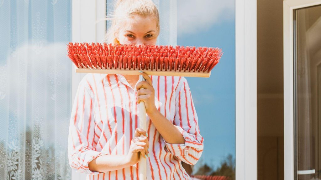 woman with cleaning tool