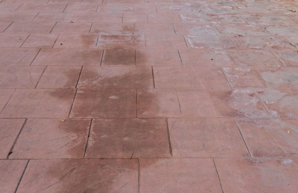 Stamped concrete floor outdoor pavement worn out, appearance of natural stone